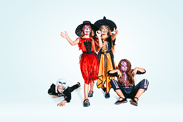 Image showing Kids or teens like witches and vampires on white background