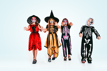 Image showing Kids or teens like witches and vampires on white background