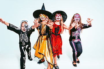 Image showing Kids or teens like witches and vampires on white background