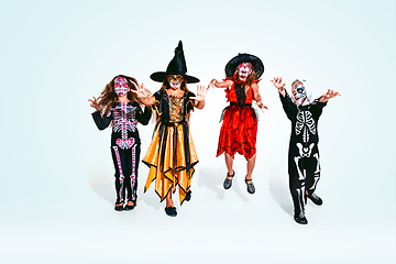 Image showing Kids or teens like witches and vampires on white background