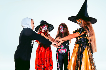 Image showing Kids or teens like witches and vampires on white background