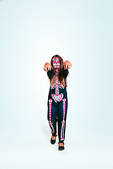 Image showing Little girl like a zombie on white background