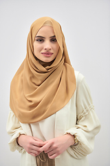 Image showing Portrait of young muslim woman wearing hijab on isolated white background