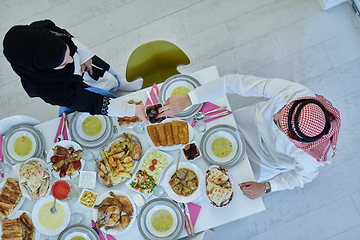 Image showing Muslim couple sharing dates for starting iftar top view