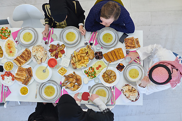 Image showing Top view of muslim family having Iftar during Ramadan holy month