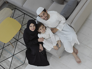 Image showing Top view of young arabian muslim family wearing traditional clothes
