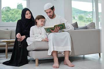 Image showing Young muslim family reading Quran during Ramadan