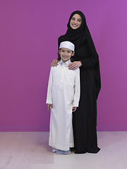 Image showing young arabian mother and son wearing traditional clothes