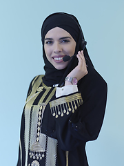 Image showing Portrait of young muslim woman with headphones