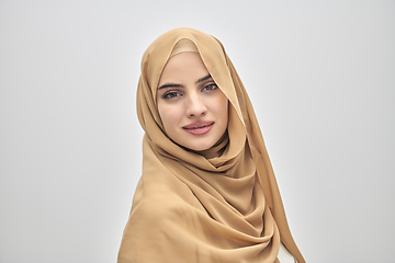 Image showing Portrait of young muslim woman wearing hijab on isolated white background