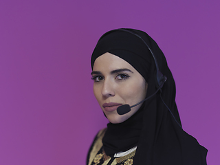 Image showing Portrait of young muslim woman with headphones