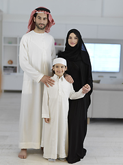 Image showing young arabian muslim family wearing traditional clothes