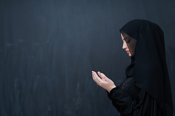 Image showing Portrait of young Muslim woman making dua