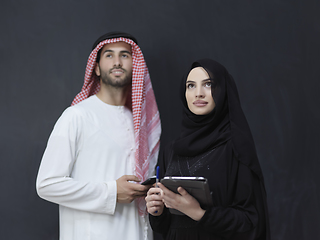Image showing Young muslim business couple using technology devices