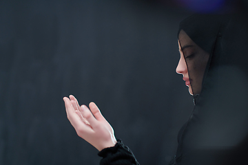 Image showing Portrait of young Muslim woman making dua