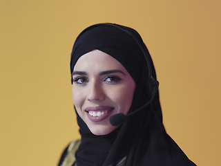 Image showing Portrait of young muslim woman with headphones