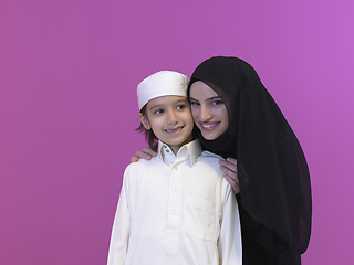 Image showing young arabian mother and son wearing traditional clothes