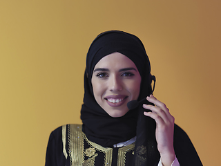 Image showing Portrait of young muslim woman with headphones