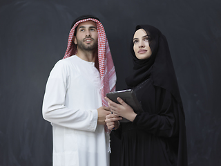 Image showing Young muslim business couple using technology devices