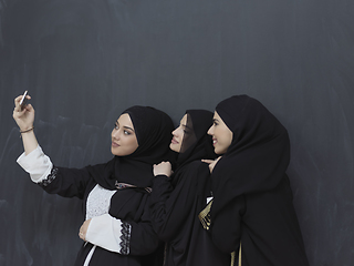 Image showing Portrait of Arab women wearing traditional clothes or abaya taking selfie