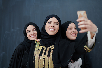 Image showing Portrait of Arab women wearing traditional clothes or abaya