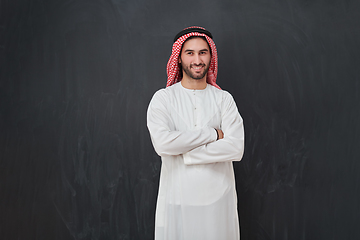 Image showing Young muslim man with crossed arms smiling