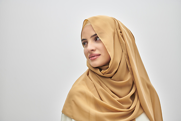 Image showing Portrait of young muslim woman wearing hijab on isolated white background