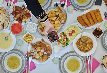 Image showing Top view of muslim family having Iftar during Ramadan holy month