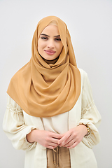 Image showing Portrait of young muslim woman wearing hijab on isolated white background