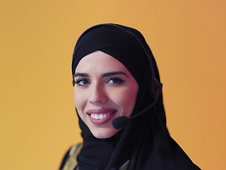 Image showing Portrait of young muslim woman with headphones