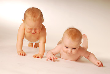 Image showing Babies lying on a ground