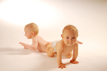 Image showing Babies lying on a ground