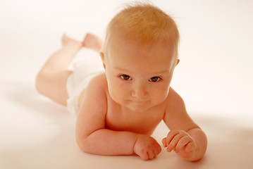 Image showing Baby lying on a ground