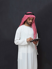 Image showing Portrait of young muslim businessman using tablet