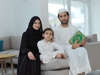 Image showing Young muslim family reading Quran during Ramadan