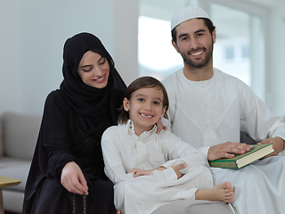 Image showing Young muslim family reading Quran during Ramadan