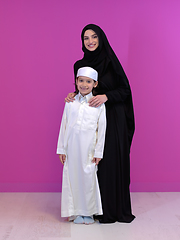 Image showing young arabian mother and son wearing traditional clothes