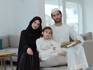 Image showing Young muslim family reading Quran during Ramadan