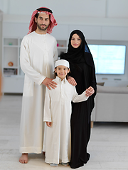 Image showing young arabian muslim family wearing traditional clothes