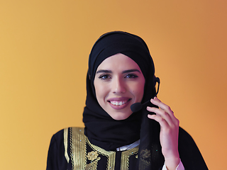 Image showing Portrait of young muslim woman with headphones