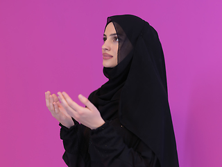 Image showing Portrait of young Muslim woman making dua