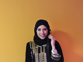 Image showing Portrait of young muslim woman with headphones