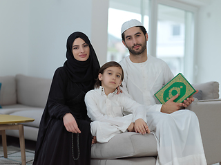 Image showing Young muslim family reading Quran during Ramadan