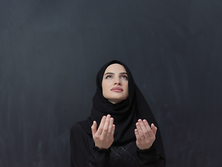 Image showing Portrait of young Muslim woman making dua