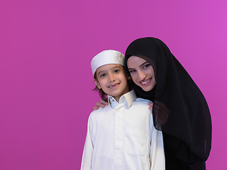 Image showing young arabian mother and son wearing traditional clothes
