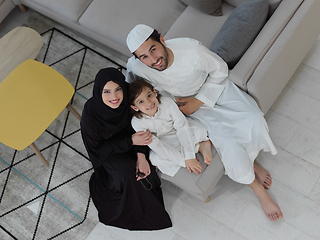 Image showing Top view of young arabian muslim family wearing traditional clothes