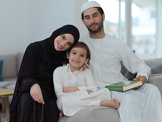 Image showing Young muslim family reading Quran during Ramadan