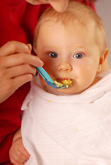 Image showing Feeding of a small hungry baby