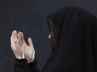 Image showing Portrait of young Muslim woman making dua