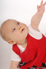 Image showing A child sitting on a floor